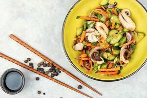 Asian cucumber and octopus salad. photo