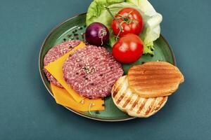 Fresh ground burger patties for cooking. photo