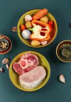 Assortment of raw meat and vegetables. photo