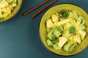Fresh exotic vegan salad with pineapple. photo