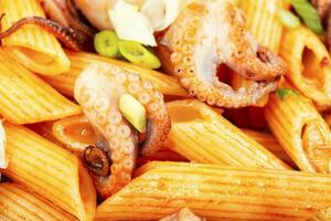 Greek food, octopus and macaroni. photo