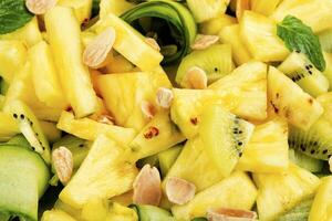 Juicy pineapple and cucumber salad, close up. photo