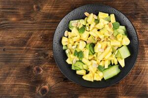 Diet pineapple and cucumber salad. photo
