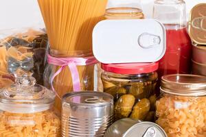 Food Reserves. Canned Food, Spaghetti, Pate, Tuna, Tomato Juice, Pasta, Fish and Grocery. Emergency Food Storage in Case of Crisis. Strategic Food Supplies photo