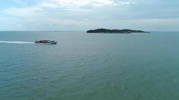 Aerial view of luxury speed boat cruising in the ocean. Shot. Aerial shot of luxury yacht cruising at sea video