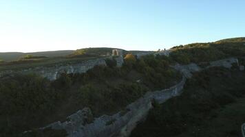 Gorges and mountain peak under blue sky. Shot. Aerial view of mountain landscape. video