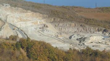 Aerial view of quarry for the extraction of chalk. Shot. Heavy machinery equipments video