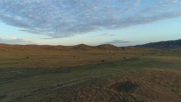 Wonderful sunset with wide field. Shot. Beautiful blue sky, orange clouds, and hills in the background video