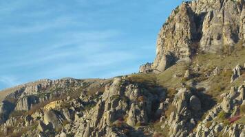 Mountain trail on rocky slope under blue sky. Shot. Wonderful view on European rocks video