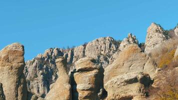 Close-up of sharp rock formation. Shot. Mountains against blue sky video