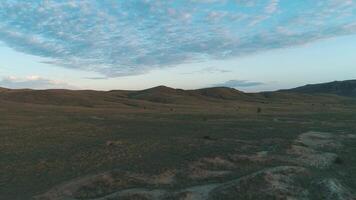 Early morning clouds over a wide field. Shot. Beautiful morning landscape video