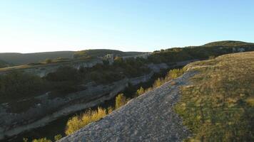 Gorges and mountain peak under blue sky. Shot. Aerial view of mountain landscape. video