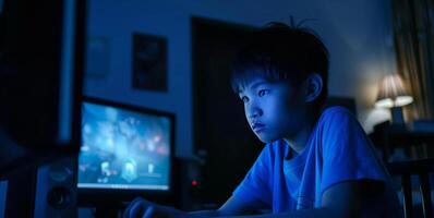 AI generated young teenage boy staring at computer screen cyberbullying in online gaming photo