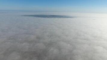 Fog above the ground. Top view of the fog. Low clouds. Morning mist condensation. Shooting with a drone photo