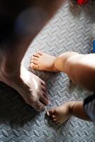 Adult And Children Feet On Ground photo