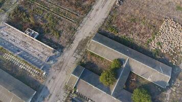 The building of an old farm for cattle. Top view of the farm. Storage of bales of hay on the old farm photo