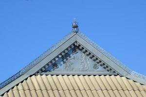 Decorative elements on ridge of roof photo