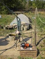 Irrigation system in the home garden. Well with manual and automatic pump. photo