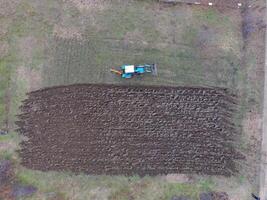 Tractor plowing the garden. Plowing the soil in the garden photo