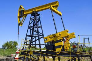 Pumping unit as the oil pump installed on a well photo