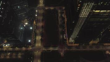 Night city, traffic, top view. Shot. Aerial view of busy street in city at night. Flying over street road video