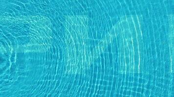 Water from a pool in close-up. Scene. Close-up of colorful swimming pool underwater background video