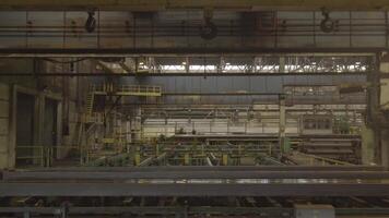 Factory overhead crane. Yellow steel load-lifting hook. Factory overhead crane on a yellow beam Close up video
