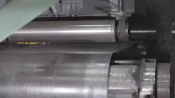 Forming machine for corrugated steel plate. Manufacture of pipes. Industrial machine close up video