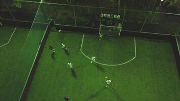 Aerial football match play. Clip. Aerial shot Two teams playing ball in football outdoors, top view. FIFA WORLD CUP 2018, Russia Football game outdoors, green field with markings, players running video