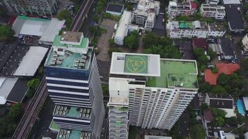 Aerial view on sleeping neighborhood in district with new houses. Business and culture concept - panoramic modern district skyline bird eye aerial view. Top view of center in Bangkok of Thailand video