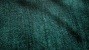 jeans tecido texturizado verde vibrando. animado movimento do a tela. a ondas do a material video