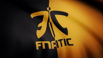 Cybergaming Fnatic flag is waving on transparent background. Close-up of waving flag with Fnatic cybergaming logo, seamless loop. Editorial animation video