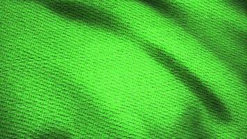 Denim fabric textured green fluttering. Animated movement of the canvas. The waves of the material video