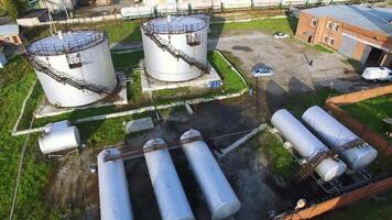 Aerial top view oil storage tanks. Stock. Top view of the large oil tanks video