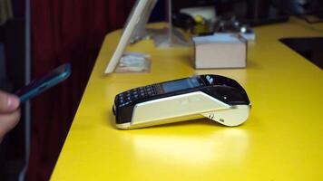 Man using NFC technology on smart phone to pay bill. Pay for purchases using NFC video