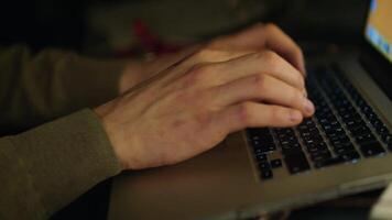 Close up of male hands typing text or programming code in computer in natural ambient light at late evening. Stock video