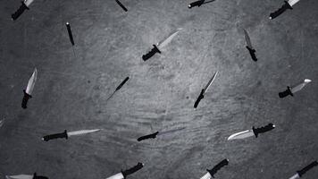 Big knives blade close up isolated on gray background. Animation of the flying knives. The concept of a large number of weapons video