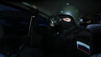 Riot police go on a call in the car. A police squad went to the urgent call of a robbery, a terrorist attack or crime video