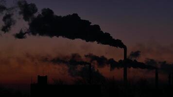 Smoking factory chimneys. Environmental problem of pollution of environment and air in large cities. View of large plant with Smoking pipes. Timelapse video