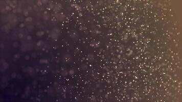 Glittering particles sparkle and drift along. Abstract background with shining bokeh sparkles. Abstract golden bokeh particles. Animation of points in space video