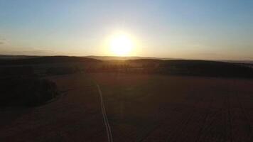 Beautiful landscape with a ride on the highway the trucks and a few cars at sunset. aerial view. Footage. video