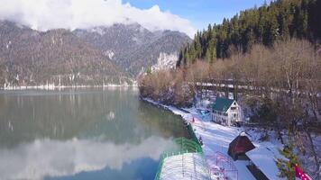 Top view of the lake house in the mountains. Clip. Beautiful weather in winter, clean air, lake house video