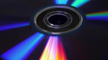 Background of compact disks or dvds. Glare of light on the disk DVD , beautiful colored glare from the light, the background disk DVD video