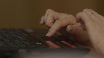 A Woman's hand with the fingers on a laptop mousepad. Woman's hand using laptop mouse video