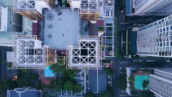 Top view of modern town with skyscrapers. Aerial of an amazing landscape on a city with modern skyscrapers and enterprises. Top view on a developed town with office buildings and advanced video