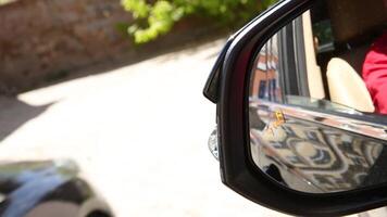 Blind Spot Monitoring system warning light icon in side view mirror of a modern vehicle. system blind spots of the car video