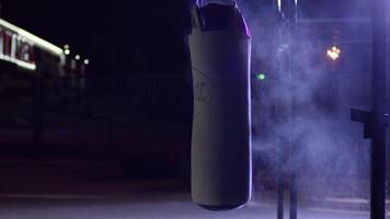 Gym,Punching bags. Punching bags in boxing room, sport. Punching bag at the dark sports ground video