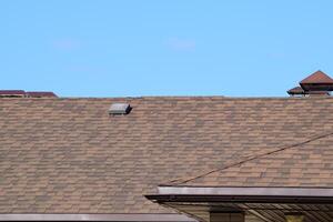 Decorative metal tile on a roof photo