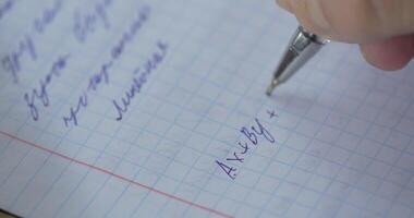 Mathematics, Equations close-up. Homework. Solving Mathematical Problem. Student solves the equation on paper video
