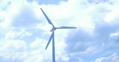 Beautiful sunset above the windmills on the field. Windmill against blue sky with motion in blades. Beautiful sunset above the windmills on the field. video